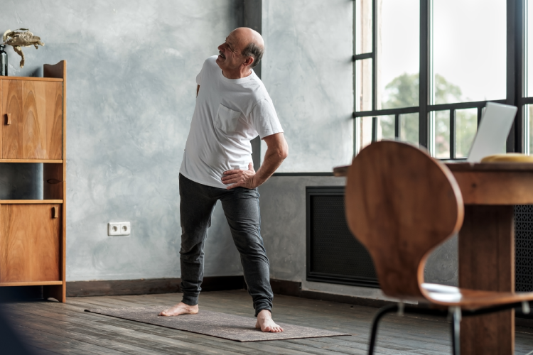 elderly-man-practicing-yoga-or-fitness