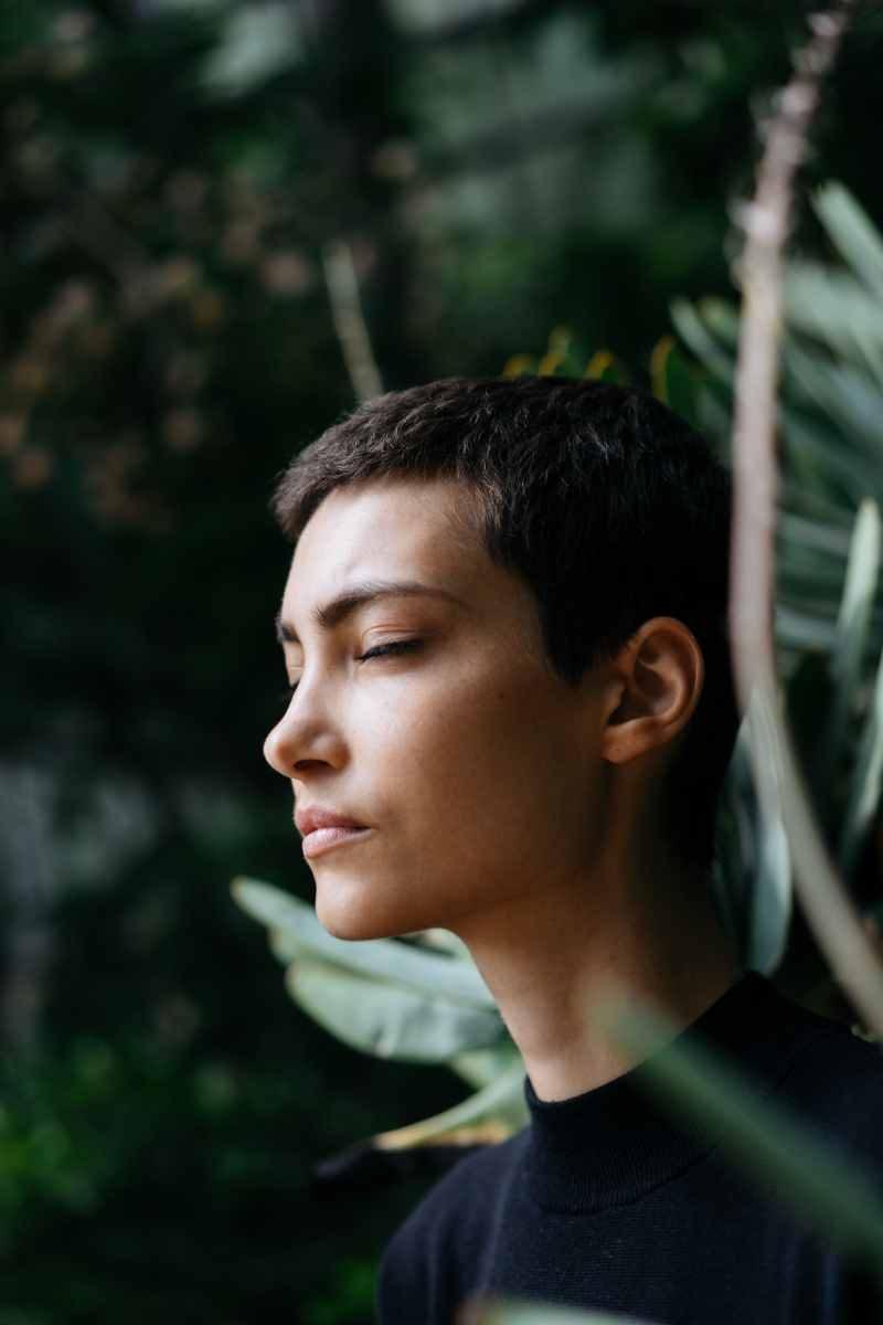 mindfulness-anxiety-ezOKZhYJAFo young man meditating in forest