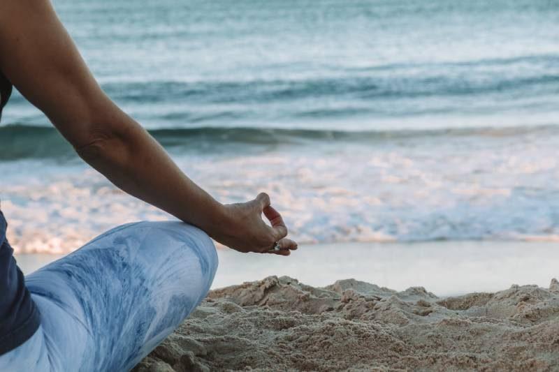 mindfulness-anxiety-n8L1VYaypcw woman meditating at the beach
